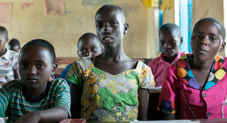 “Because today is the African Child Day, we only have some students in class. Sometimes it is difficult to concentrate, because class-sizes are so big”, said 13-year-old Elia (centre) in mid-June. He goes to the Ntezirayo School in Rwamwanja. FCA has built the school’s two classrooms. Photo: Juha Haapala