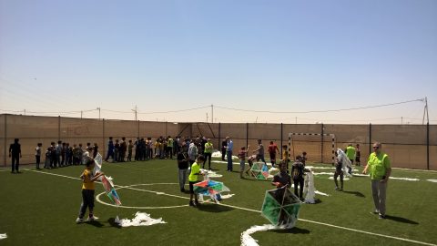 Volunteers building kites here on the football pitch of Zaatari refugee camp. This major event would not have been possible without their help.