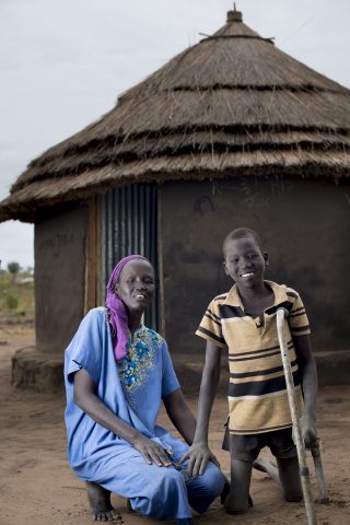 Chawich and his mother outside their tuku hut. Chawich’s wish of an education will finally be realised in the Inclusive Education facility funded bv FCA.