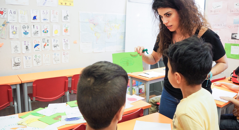 Natassa Tseliou teaches refugee children the basics of Greek.