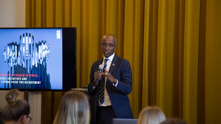 Mohamed Yahya, lead author of UNDP's report Journey to Extremism, presenting key findings of his research. Photo: Rabbe Sandström
