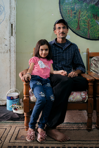 Ibrahim and layal sitting in the living room.