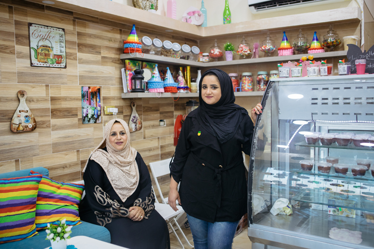 Rana with her mother in the chocolate shop.