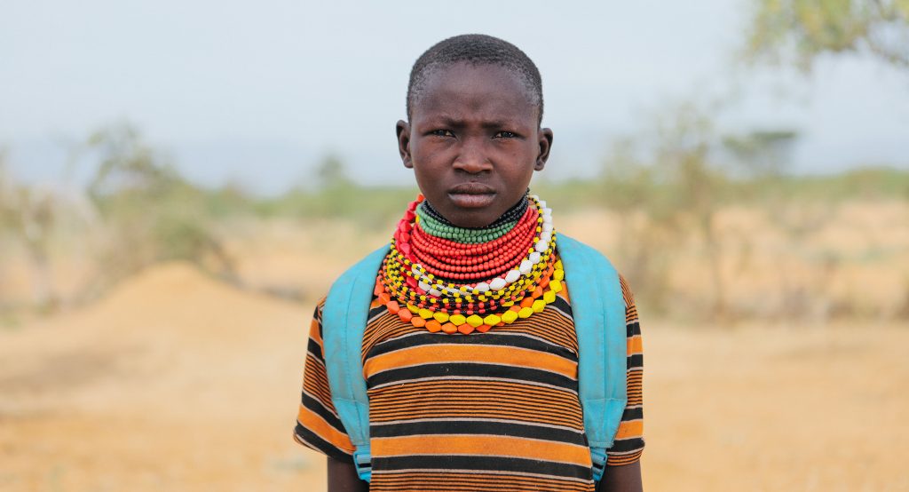 Rebecca Atubo, 12, säger sig tycka bättre om skolan än om att valla djur. Hennes favoritämnen är engelska och matematik. Foto: Tatu Blomqvist/Kyrkans Utlandshjälp