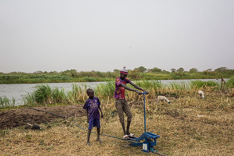 The water pump has caught the interest of the youngest South Sudanese children in the village.