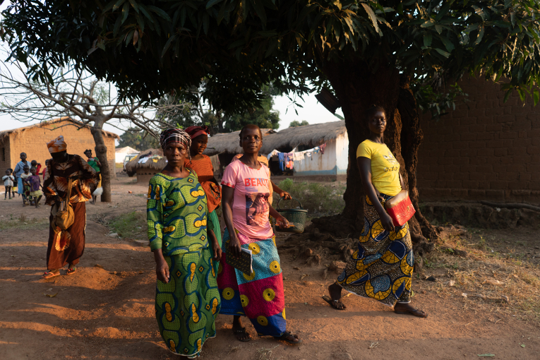 Women walking home after a literacy class has ended.