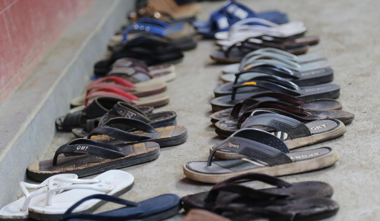 Shoes outside of a classroom.