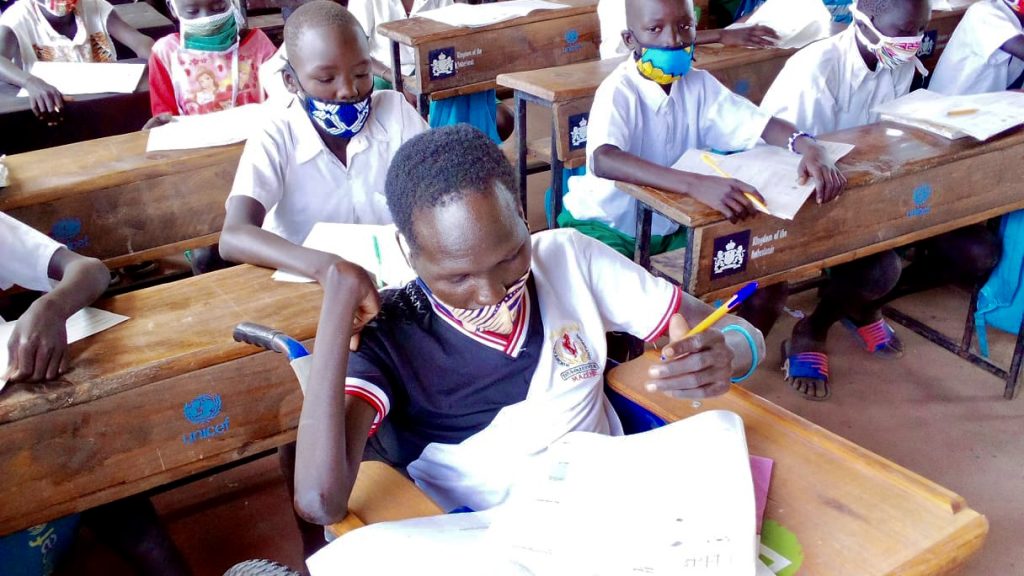 Simon Peter has returned to class after schools gradually reopened in Kenya's refugee settlements. Photo: Finn Church Aid