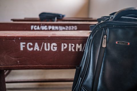 School desk with text FCA and a rugsack.