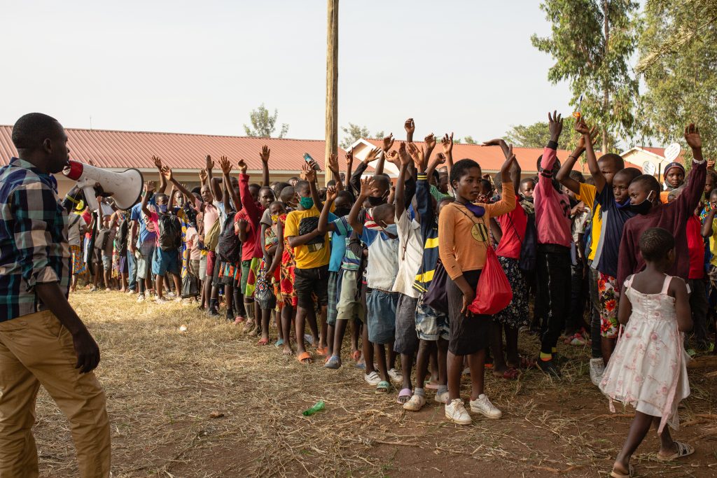 Pupils queuing in front of their school in Uganda.