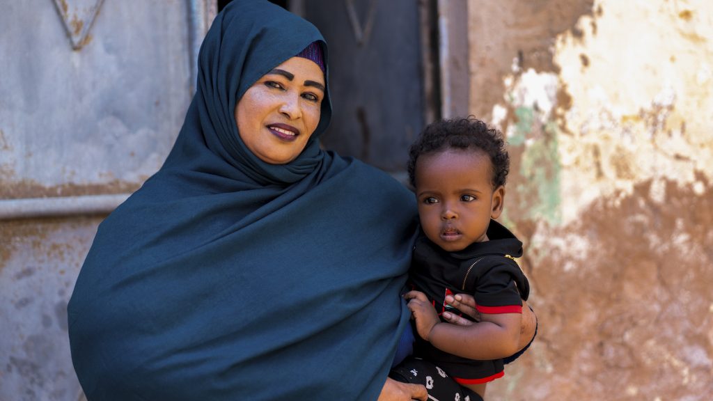 A woman holding a baby in Somalia. 