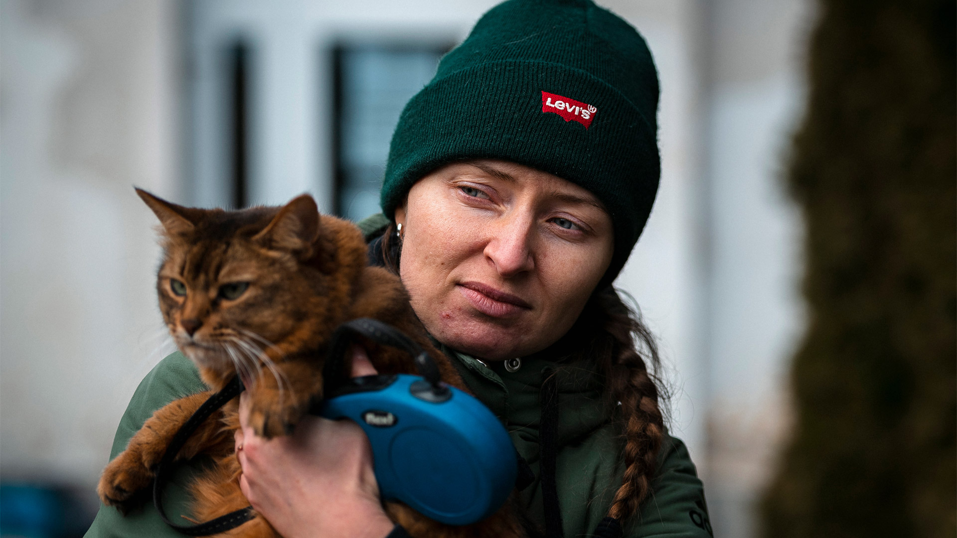 A woman holds a cat
