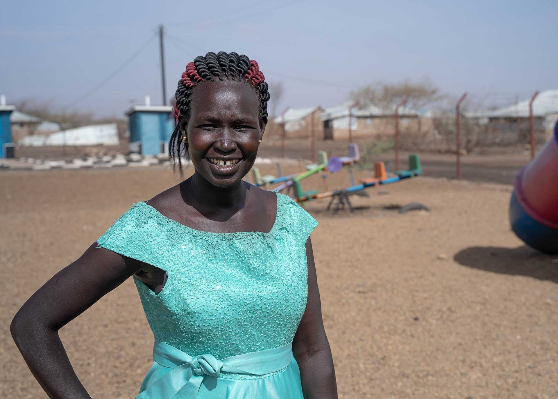 A Kenyan woman poses for a photograph.