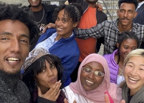 A group of young people pose for a selfie