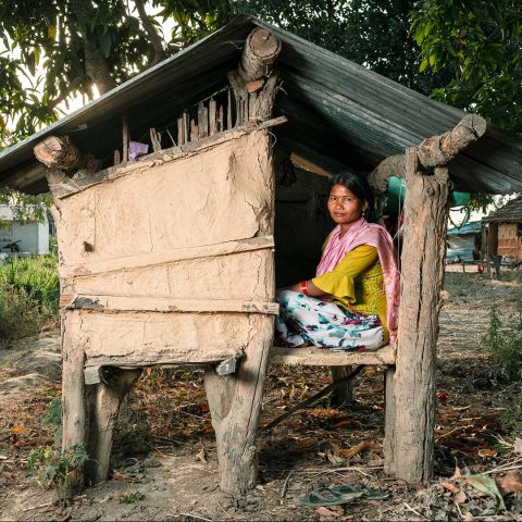 A woman sitting in a hut in rural Nepal.
