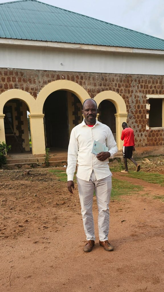 A man standing in front of a building