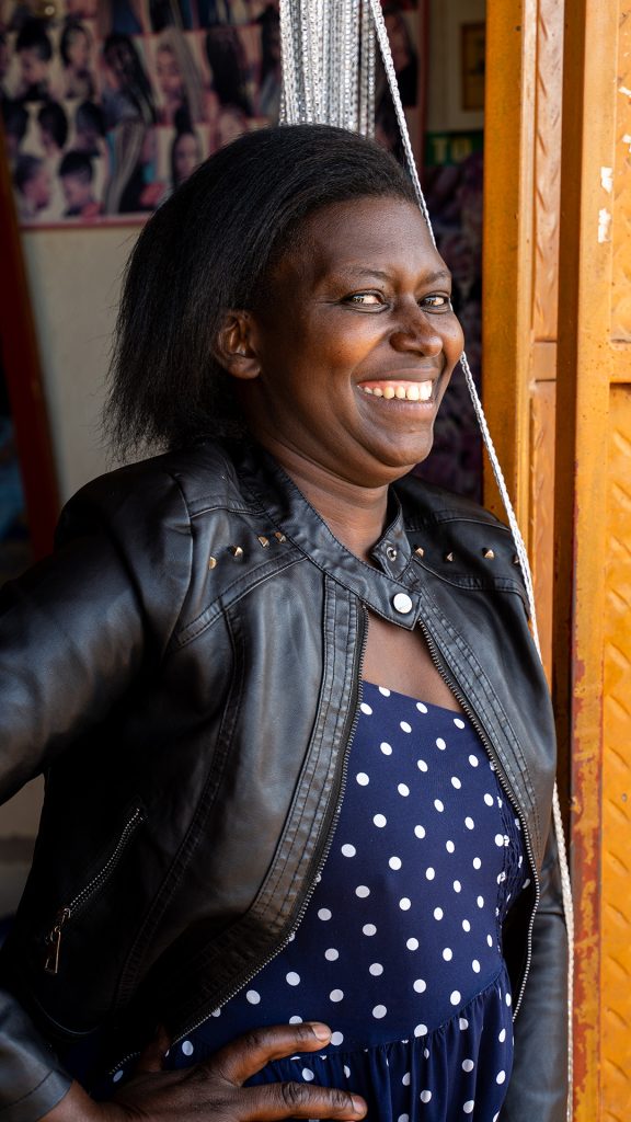 A woman standing in a doorway.