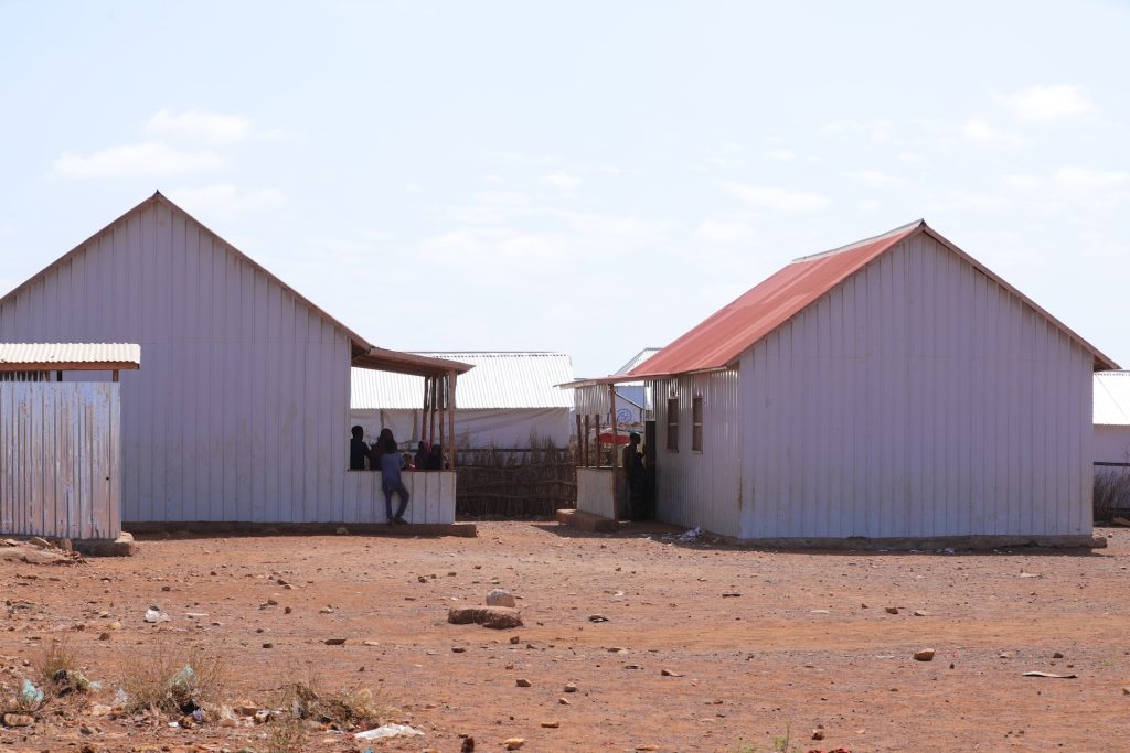 Two builders next to each other in an arid landscape
